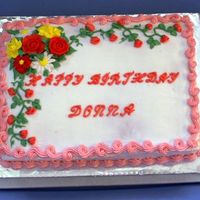 Donna's Birthday Cake Yellow cake iced and decorated with BC.