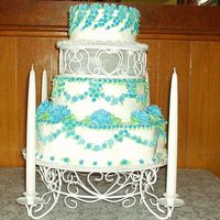 Drop Flowers And Roses Lots of drop flowers and only 8 roses. The Brides mother ordered this cake and then forgot to get a topper. Luckly she was able to find a...