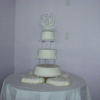 Fondant Cake This was done a couple of yrs. ago it was my 1st wedding cake / fondant and brushed embroidery. The Bride ordered orchid sprays for the...