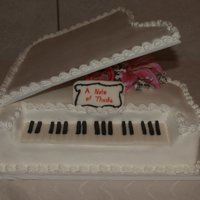 Piano Cake Got the idea from someone one here on CC. Lid is cardboard covered in Buttercream, keys are MMF and cake is iced in BC
