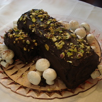 Buche De Noel My first Christmas log. I wasn't totally happy with the placement of the "knot', but overall thought this turned out great...