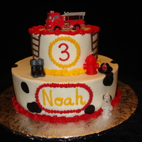 Fire Truck Birthday Colorful fire station themed cake. Buttercream and fondant "spots" with candle accents + truck on top. The little boy loved it!...