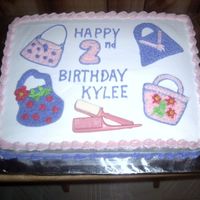 "purses" Birthday Cake She wanted purses on her cake and hair stuff, like combs and brushes. I was glad to hear that. I finally got to use the comb and brush...