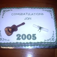 Graduation Cake With Guitar Guitar is molded from candy melts. rolled fondant diploma.
