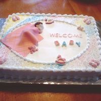 Baby Shower baby is molded from candy melts. Fondant blanket.