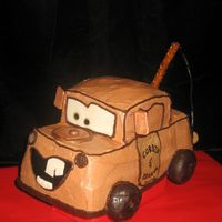 Like Tow-Mater, But Without The Tow... Here's Mater from the movie Cars. Made with a loaf pan and a 4-inch square trimmed to form the cab. Chocolate buttercream with fondant...