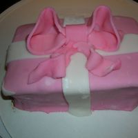 Christmas Present Chocolate cake with ganche and Fondant wraping and bow.