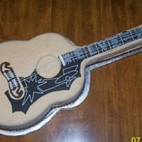 Elvis Guitar Cake This cake was requested by a groom. He wanted an exact replica of his favorite guitar...Elvis' 1956 Gibson J200. Cake is covered in...