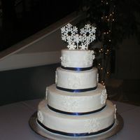 Snowflake Wedding Cake My first wedding cake. Thanks to Bernadette and everyone else that helped. White cake w/ snowwhite butterecream frosting and RI snowflakes...
