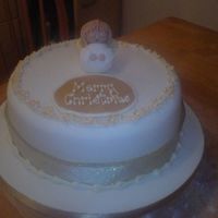 Angel Christmas Cake Fruit cake covered in marzipan and then sugarpaste (coloured ivory) sugar paste angel and flowers round the edge