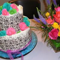 Aly's Shower Cake This is my first attempt at a chocolate wrap. It was easy except I had trouble getting all of the picture to stick yo the chocolate.