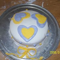 Purple And Yellow Hearts,fondant mmf.Strawberry cream cheese.All mmf 9in 2 layer.Braided border!No classes for this just some help from my aunt.I do start a class in 2...