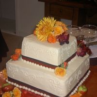 Fall Wedding Cake Wedding cake for my sister-in-laws small wedding. There were about 30 people. Buttercream with fresh flowers. The top layer is chocolate...