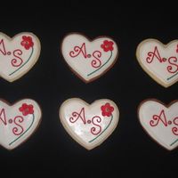 Bridal Shower Cookies Heart cookies iced with Toba's Glaze. Fondant flower and royal icing initials and details.