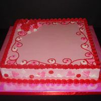 Valentine's Day Cake Buttercream icing with fondant-cut outs and royal icing roses.