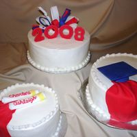 Graduation_3_Tier.jpg 3 tier graduation cake, with fondant accentsi saw the idea on here; they loved it :)