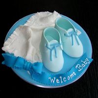 Baby Shower Gift I made this as a gift for the same person who ordered the blue baby shower cake. It's all edible with the exception of the cardboard...