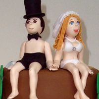 Honeymoon Couple Gumpaste toppers for a wedding shower cake.