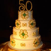 Community College 50Th Anniversary Local community college's 50th anniversary celebration cake. They wanted a showpiece type of cake with gold and some green accents....