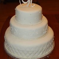 Wedding Cake Jennifer's Dontz's white chocolate fondant and white chocolate clay pearls. WASC cake with amaretto bavarian cream filling....
