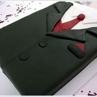 Tuxedo Groom's Cake Made to match the tux the groom was wearing, this cake went with the dress cake for my cousin's wedding in Texas. 11"x15"...