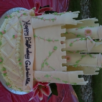 Princess Castle This is a Princess Castle cake that was done for my niece's party. The walls, towers and banner are fondant with royal icing...