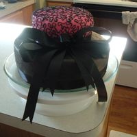 Mom's 50 Th Birthday chocolate cake with chocolate fondant ,pink fondant is flavored vanilla.. I decided to make a elegant cake because mom did not want to see...