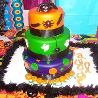 Girls Halloween Birthday Cake I made this for a girls Birthday/ Halloween party. I had made a really pretty bow to put on top and it fell apart when I was going to put...