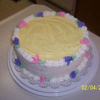 Banana Split Cake The yellow frosting on top of the cake is banana flavored, the bottom layer of cake is chocolate, the top layer is strawberry with carmel...