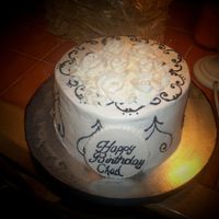 Black And White white buttercream with black scrolls and white buttercream roses.