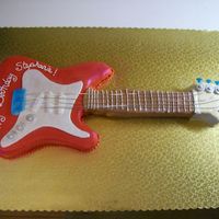 Guitar Cake This was fun for my first guitar, a few things I will do differently next time, made with MMF and gumpaste accents