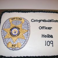 Sheriff's Badge From Gumpaste My friend's husband graduated from the police academy and this was his badge that I created from gumpaste