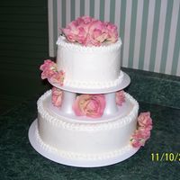 Pink_Roses.jpg this was my latest wedding cake i did for a very small wedding, about 8 people.