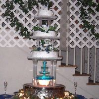 Timmys_Cake.jpg this was my cousins wedding cake, it was so tall i had to stand on a chair to put the top layer on.