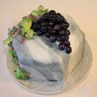 Grapes And Marble This is a small cake I made for my mothers birthday. Covered in fondant and made to look like marble, the grapes are a mix of fondant and...