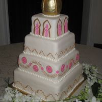 Weddincake2.jpg Square, fondant covered wedding cake. Bride was incorporating a Moroccan theme into her reception. Top is not edible - made from styrofoam...
