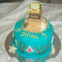 Sponge Bob Cake For my son's birthday. Very simple cake, iced in buttercream. White chocolate shells, etc. The Spongebob is actually a candle I found...