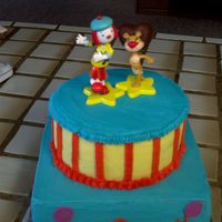 Jo Jo's Circus All buttercream. Ordered the toppers off of a party website.