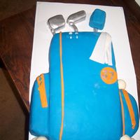 Golf Cake Made this cake for my hubby's birthday. He is a golf fanatic. All fondant, golf balls were melted chocolate in golf ball molds. I...