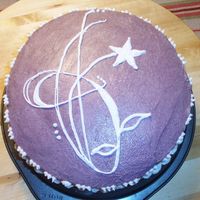 Modern Flower Just an experiment in freehand piping. Chocolate fudge w/choco. chips, BC icing