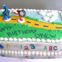 Elmo & Cookie Monster Birthday Cake Yellow cake with canned vanilla frosting and filling. This cake was modeled after a cake the mother found at Publix. I varied it up...