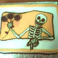 Scary Skeleton Halloween Cake Buttercream transfer skeleton, with black buttercream roses. Chocolate cake with chocolate filling.