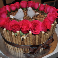 Pirouette Cookie Cake 12 inch stawberry cake with stawberry filling and wilton's recipe of white chocolate buttercream. I used multiple flavors of Piroutte...