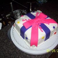 Birthday Present Cake I made this cake in my 3rd Wilton class. It was my first experience with fondant, so excuse the errors. Fondant is fun to play with but it...