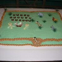 Jungle Baby Shower Cake is yellow w/buttercream frosting. Baby Boy was made with first impressions baby mold.