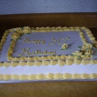 P1010068.jpg Half white half choc sheet cake in buttercream icing.