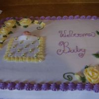 Baby Shower This is a white cake with buttercream icing.