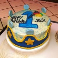 1St Birthday Cake choc. cake with cream chees frosting. forsting made the fondant crown sag but it turned out cute anyways