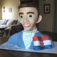 Going Away Party the head is styrofoam and the bottom is cake. its all covered in fondant and made to look like my friend who is leaving for croatia