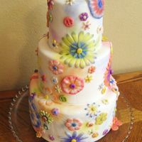 Groovy Flowers I made this cake for my county fair. The theme was "A Groovy Time in 2009". Fondant covered with fondant flowers. Used cutters...
